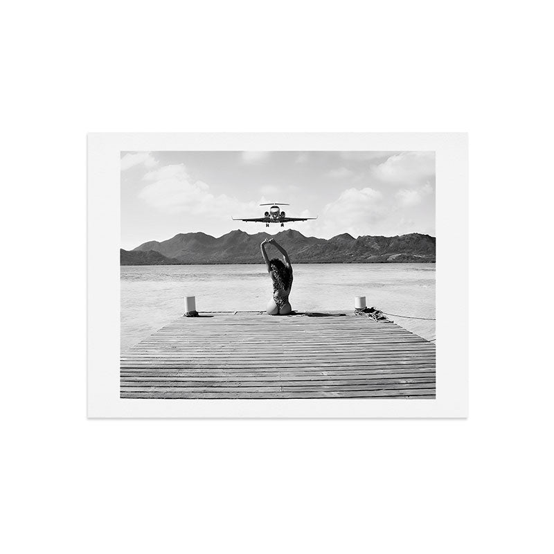 Steady as she goes girl in bikini on a dock with plane landing black and white photograph Art Print Gallery Image 9