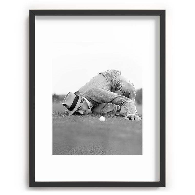 Eye to the ground on the 18th hole; golfing man eyes ball to measure distance to hole vintage black and white portrait photograph - photography - photographs poster Framed Art Print Gallery Image 83