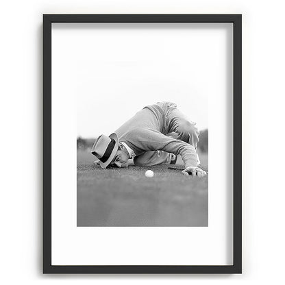 Eye to the ground on the 18th hole; golfing man eyes ball to measure distance to hole vintage black and white portrait photograph - photography - photographs poster Framed Art Print Gallery Image 83