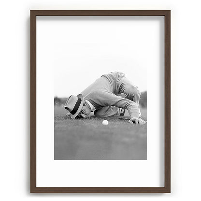 Eye to the ground on the 18th hole; golfing man eyes ball to measure distance to hole vintage black and white portrait photograph - photography - photographs poster Framed Art Print Gallery Image 92
