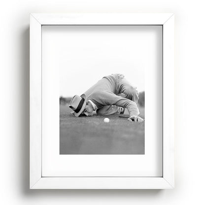 Eye to the ground on the 18th hole; golfing man eyes ball to measure distance to hole vintage black and white portrait photograph - photography - photographs poster Framed Art Print Gallery Image 103