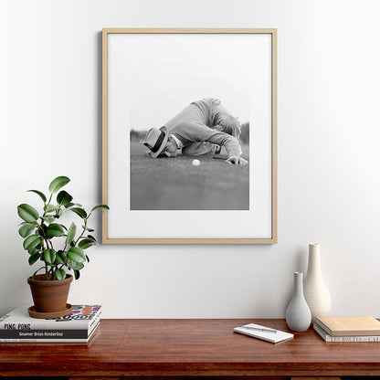 Eye to the ground on the 18th hole; golfing man eyes ball to measure distance to hole vintage black and white portrait photograph - photography - photographs poster Framed Art Print Gallery Image 29