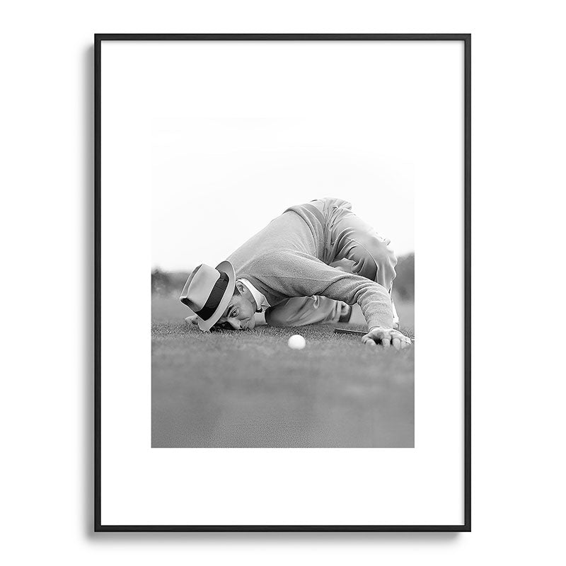 Eye to the ground on the 18th hole; golfing man eyes ball to measure distance to hole vintage black and white portrait photograph - photography - photographs poster Framed Art Print Gallery Image 116