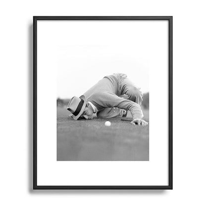Eye to the ground on the 18th hole; golfing man eyes ball to measure distance to hole vintage black and white portrait photograph - photography - photographs poster Framed Art Print Gallery Image 112