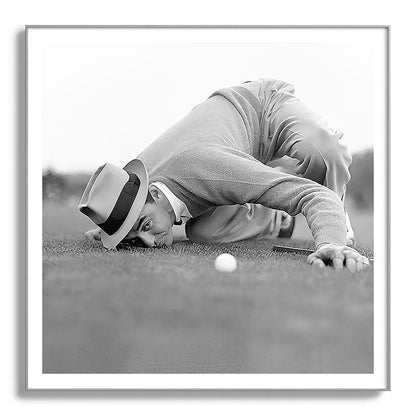 Eye to the ground on the 18th hole; golfing man eyes ball to measure distance to hole vintage black and white portrait photograph - photography - photographs poster Framed Art Print Gallery Image 142