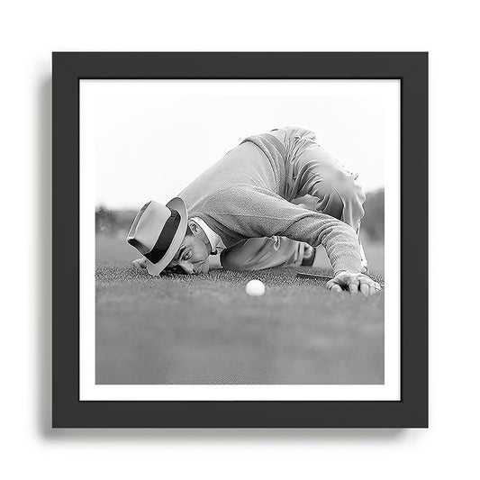 Eye to the ground on the 18th hole; golfing man eyes ball to measure distance to hole vintage black and white portrait photograph - photography - photographs poster Framed Art Print Gallery Image 2