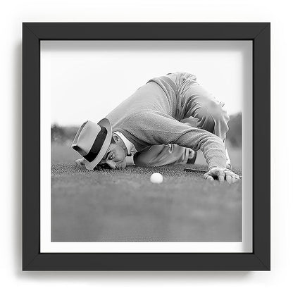 Eye to the ground on the 18th hole; golfing man eyes ball to measure distance to hole vintage black and white portrait photograph - photography - photographs poster Framed Art Print Gallery Image 90