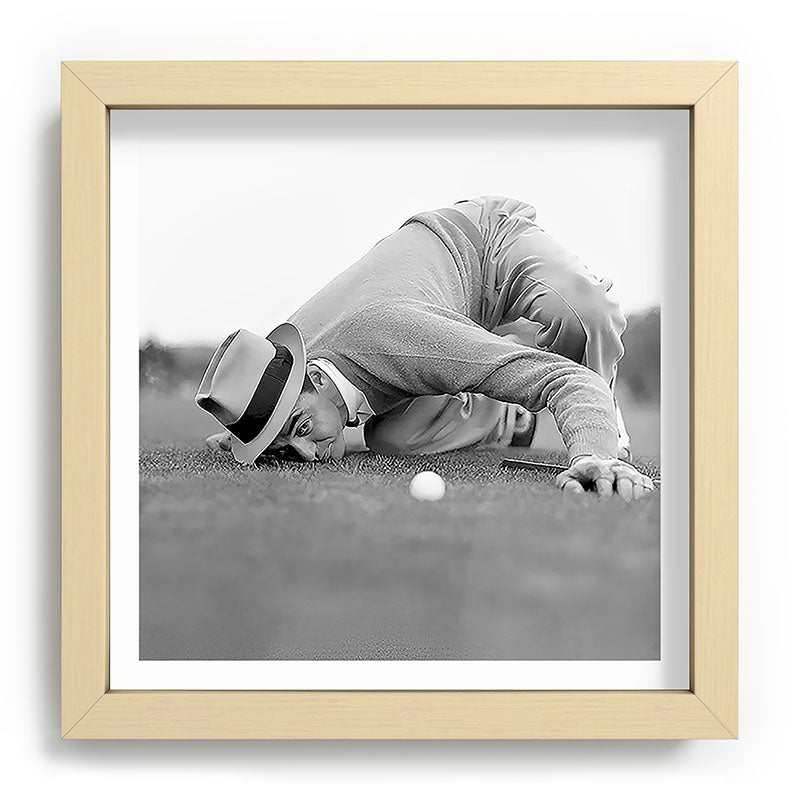 Eye to the ground on the 18th hole; golfing man eyes ball to measure distance to hole vintage black and white portrait photograph - photography - photographs poster Framed Art Print Gallery Image 106