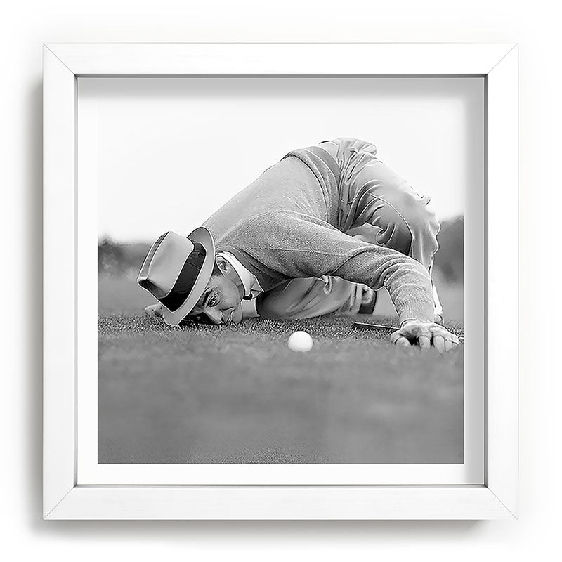 Eye to the ground on the 18th hole; golfing man eyes ball to measure distance to hole vintage black and white portrait photograph - photography - photographs poster Framed Art Print Gallery Image 114