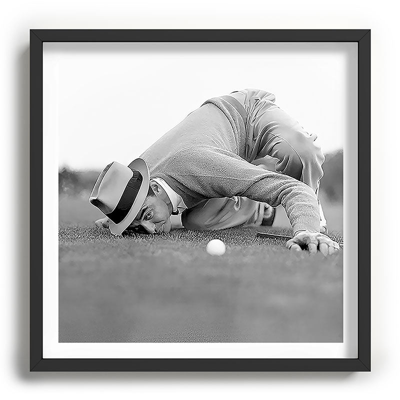 Eye to the ground on the 18th hole; golfing man eyes ball to measure distance to hole vintage black and white portrait photograph - photography - photographs poster Framed Art Print Gallery Image 93