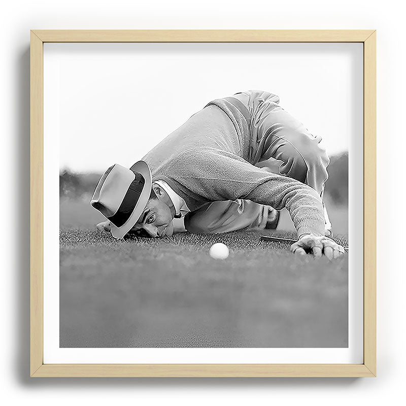 Eye to the ground on the 18th hole; golfing man eyes ball to measure distance to hole vintage black and white portrait photograph - photography - photographs poster Framed Art Print Gallery Image 109