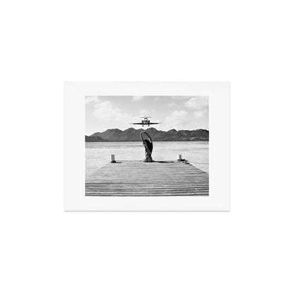 Steady as she goes girl in bikini on a dock with plane landing black and white photograph Art Print Gallery Image 4